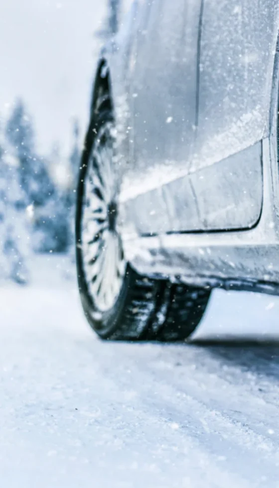 Close-up view of tires on the snow covered road