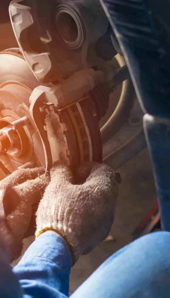 Man filling air in the tires of his car for safety and regular maintenance