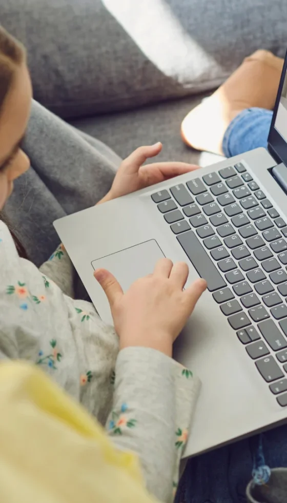 Family doctor online. Mom and little girl daughter are at home and use a video call to receive medical care online. Telemedicine concept.