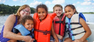 Father and sons out boating together.