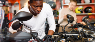 Man trying to make a decision to buy a motorcycle