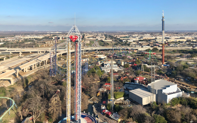 A sunny day outlines Six Flags Over Texas in Arlington with the Dallas skyline in the background – Arlington, cheap car insurance in Texas