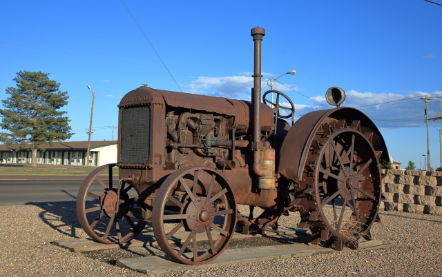 An antique McCormick-Deering tractor on public display in front of a museum along Highway 287 - Dumas, Texas, USA – Dumas, cheap car insurance in Texas