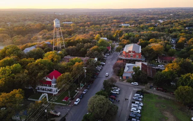 An aerial view of the Gruene Hall with buildings and trees in New Braunfels, Texas, United States – New Braunfels, cheap car insurance in Texas