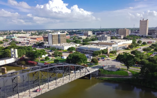 Aerial view downtown Waco from Washington Avenue Bridge cross Brazos River – Waco, cheap car insurance in Texas