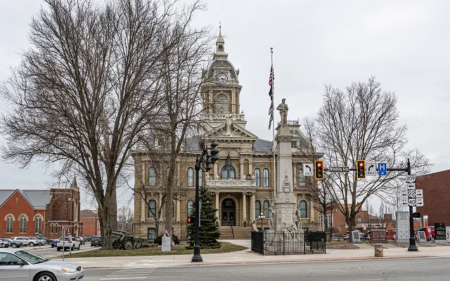Guernsey County Courthouse, built in 1883 with the Guernsey County Civil War Memorial in front, Cambridge, Ohio – Cambridge, cheap car insurance in Ohio