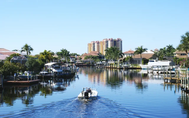 Boating along canal in Cape Coral Florida – Cape Coral, cheap car insurance in Florida