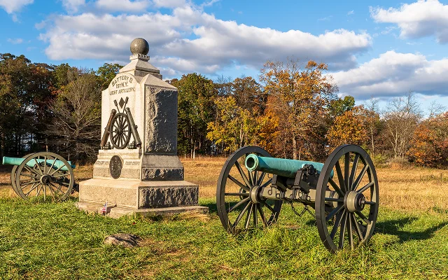 A Union monument and civil war cannons in the Wheatfield on the Gettysburg National Military Park on a sunny fall day – Gettysburg, cheap car insurance in Pennsylvania