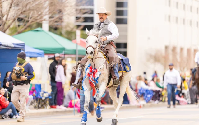 A man riding a horse at the Anheuser-Busch Washington’s Birthday Parade in Zapata County – Zapata, cheap car insurance in Texas