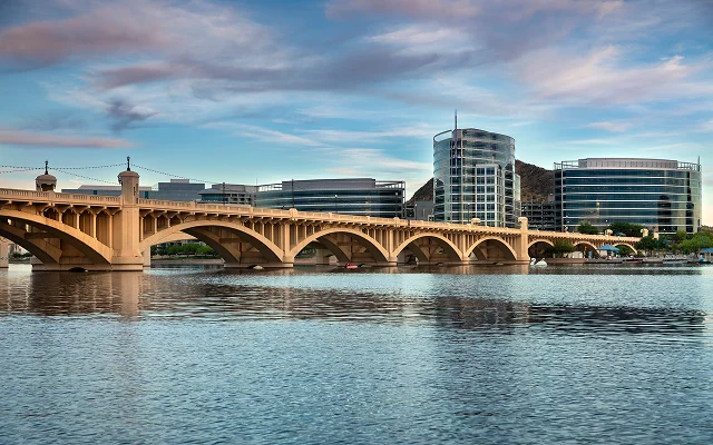 Cityscape shore view of downtown Tempe Arizona USA over the Salt River and Mill Avenue Bridge – Tempe, cheap car insurance in Arizona